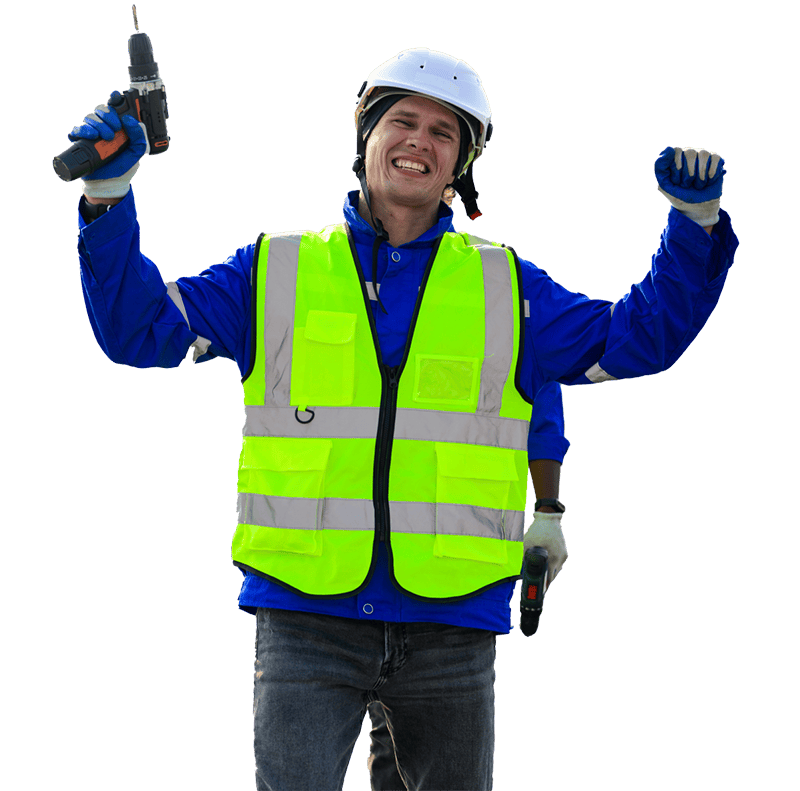 Smiling worker in a blue uniform, neon safety vest, and white helmet raises a power drill victoriously against a black background, conveying enthusiasm.